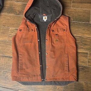 Carhartt sandstone hooded multi-pocket vest Sherpa lined orange firewood color